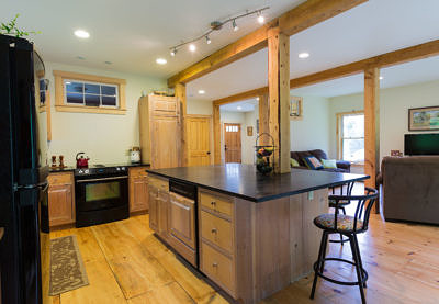 Custom kitchen and stone countertops in rustic saltbox in Fayston, Vermont