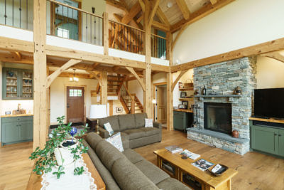 Living area and stairs in timber frame home in Fayston, Vermont