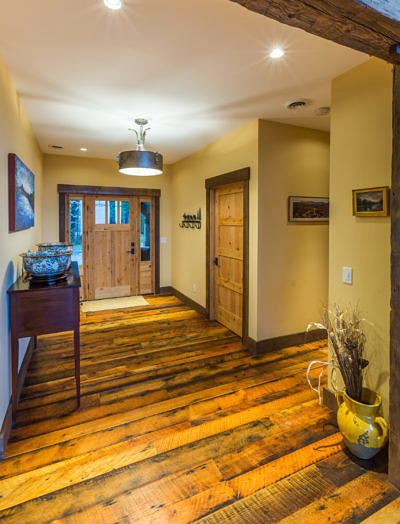 Entryway and hallway in western style lodge home in Waterbury, Vermont