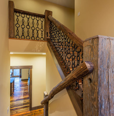 Custom staircase in western style lodge home in Waterbury, Vermont