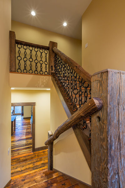 Custom staircase in western style lodge home in Waterbury, Vermont